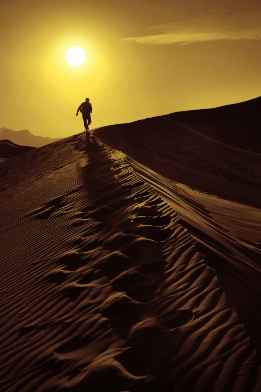 the lone person walks along a deserted dirt road