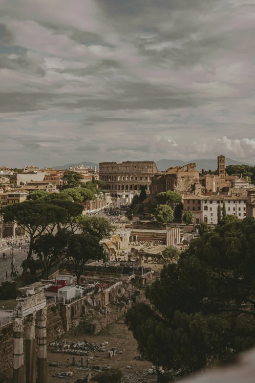 a cityscape with lots of tall buildings and an old roman bridge