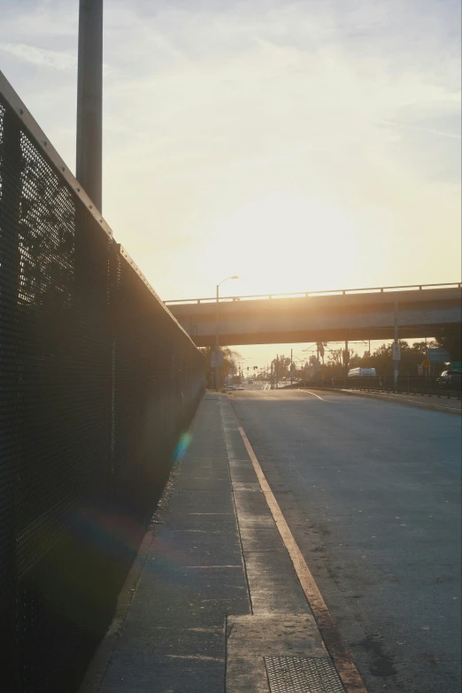 a street that has a very long bridge above it