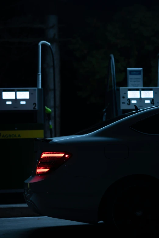 car with rear ke lights turned on at gas pumps