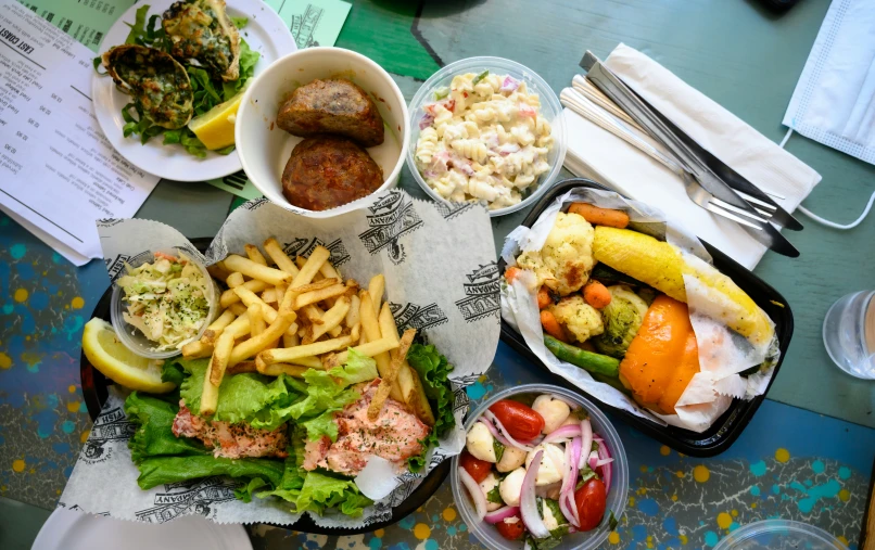 different types of food on trays at a restaurant