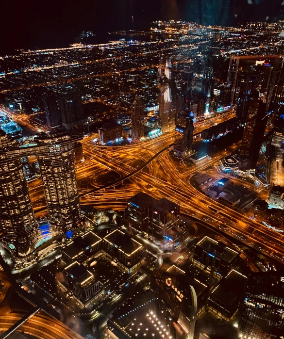 night time city scene with lights of cars on the highway and street