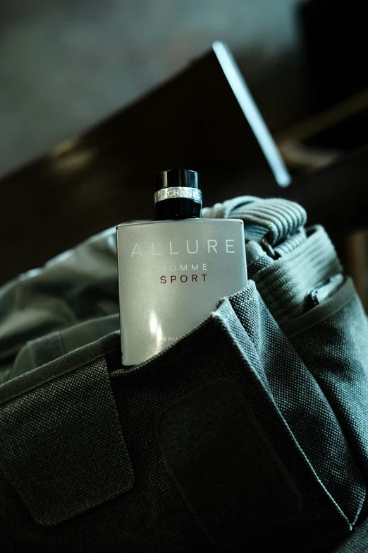a flask bottle on a backpack in a el room