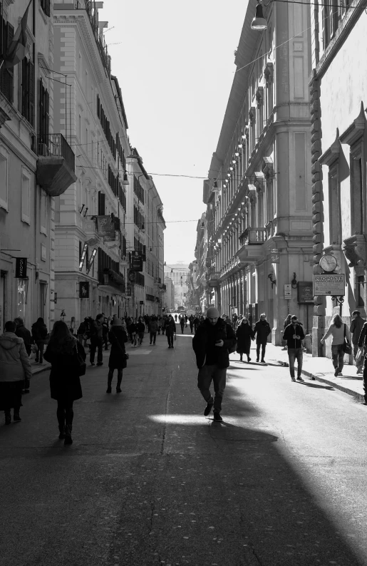 a bunch of people walking down the street