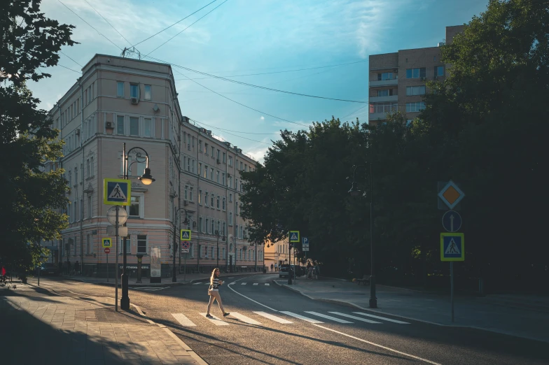 a large building sitting above a street next to a street light