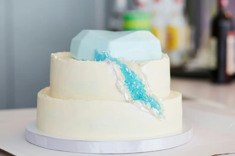 a wedding cake with a broken frosting knife