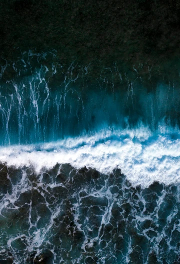 a wave is breaking in front of the camera