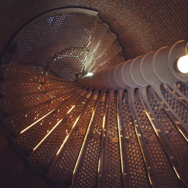 many circular wooden steps leading to a bright light