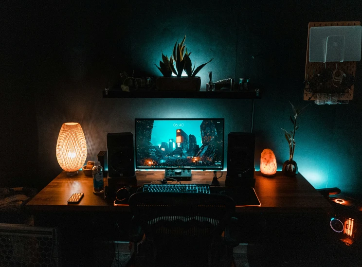 a desk with a desktop computer and a phone