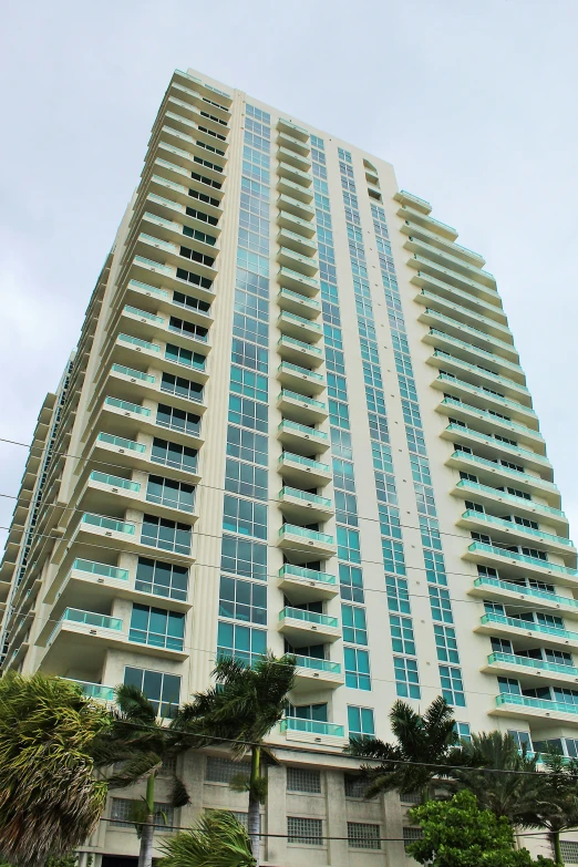 an apartment building with several stories and blue glass windows