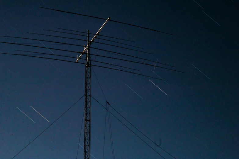 a tall radio tower sitting under a night sky