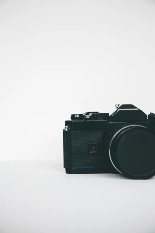 a black camera on a white background