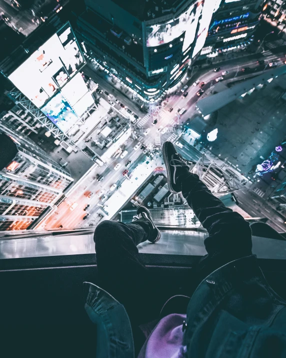 a person standing on top of a tall building