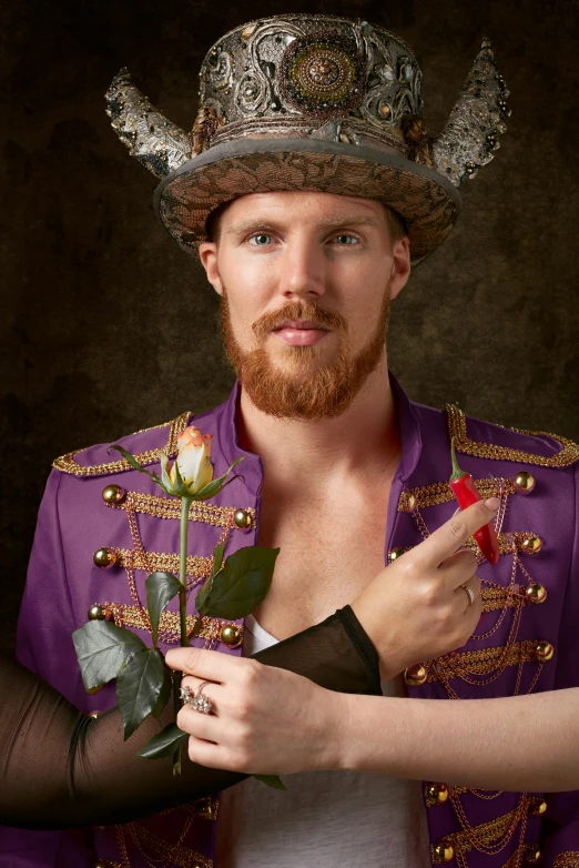 a man dressed as a princess with a flower