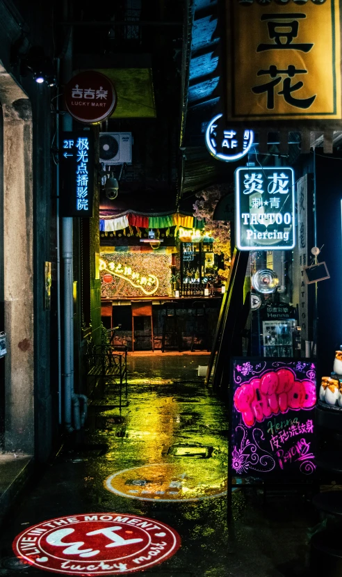 an outdoor city street at night with colorful signs