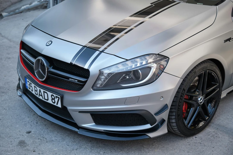 the front view of a silver mercedes benz cla