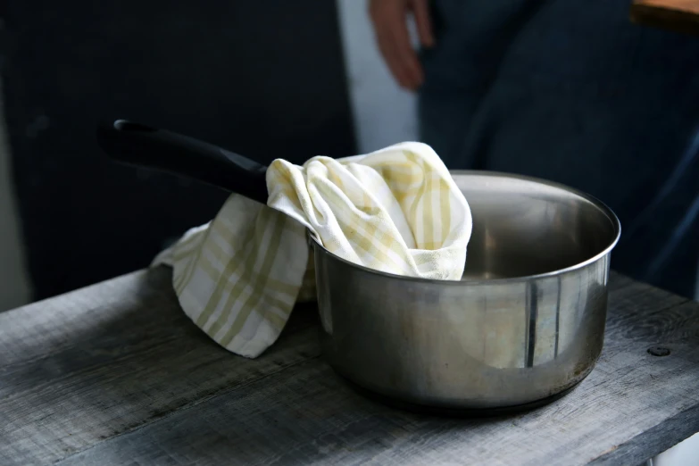 an image of a metal pan with white cloth