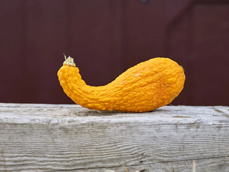 a close - up view of a yellow vegetable on a table