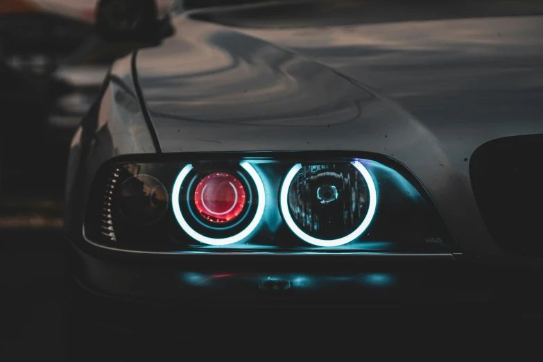 the front lights of a car with their turn signals turned