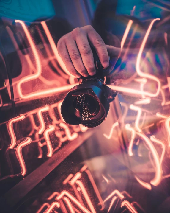 a person pouring liquid into a coffee maker