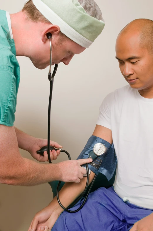 two men in scrubs have  pressure checks