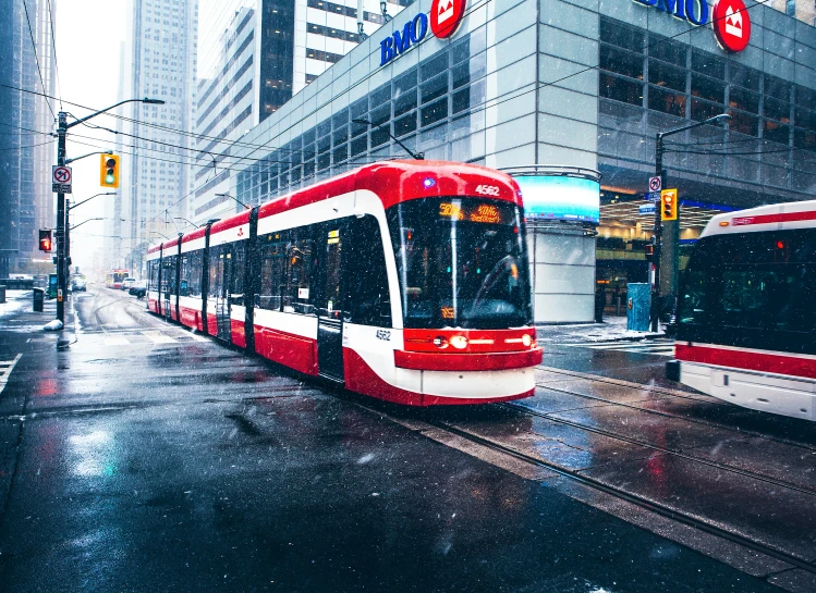 a public transportation bus moving through an urban setting