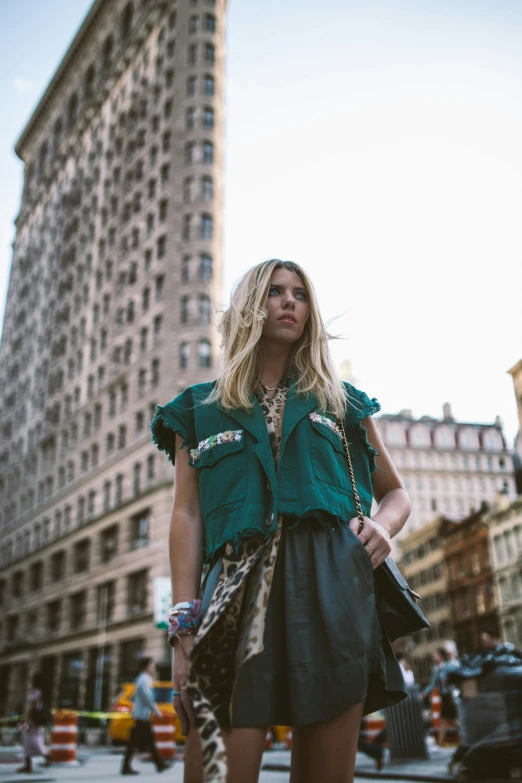 woman with long blond hair walking down the street