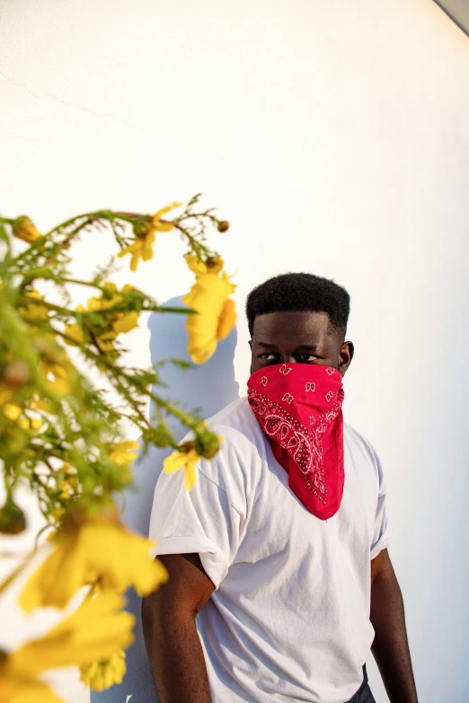 a black man wearing a red bandana on his head