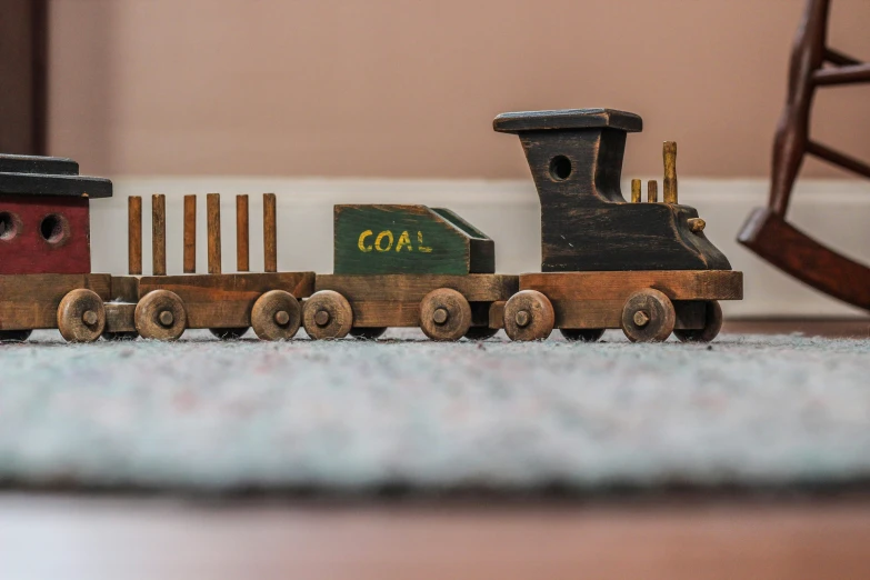 a train with a wooden box with a wooden comb