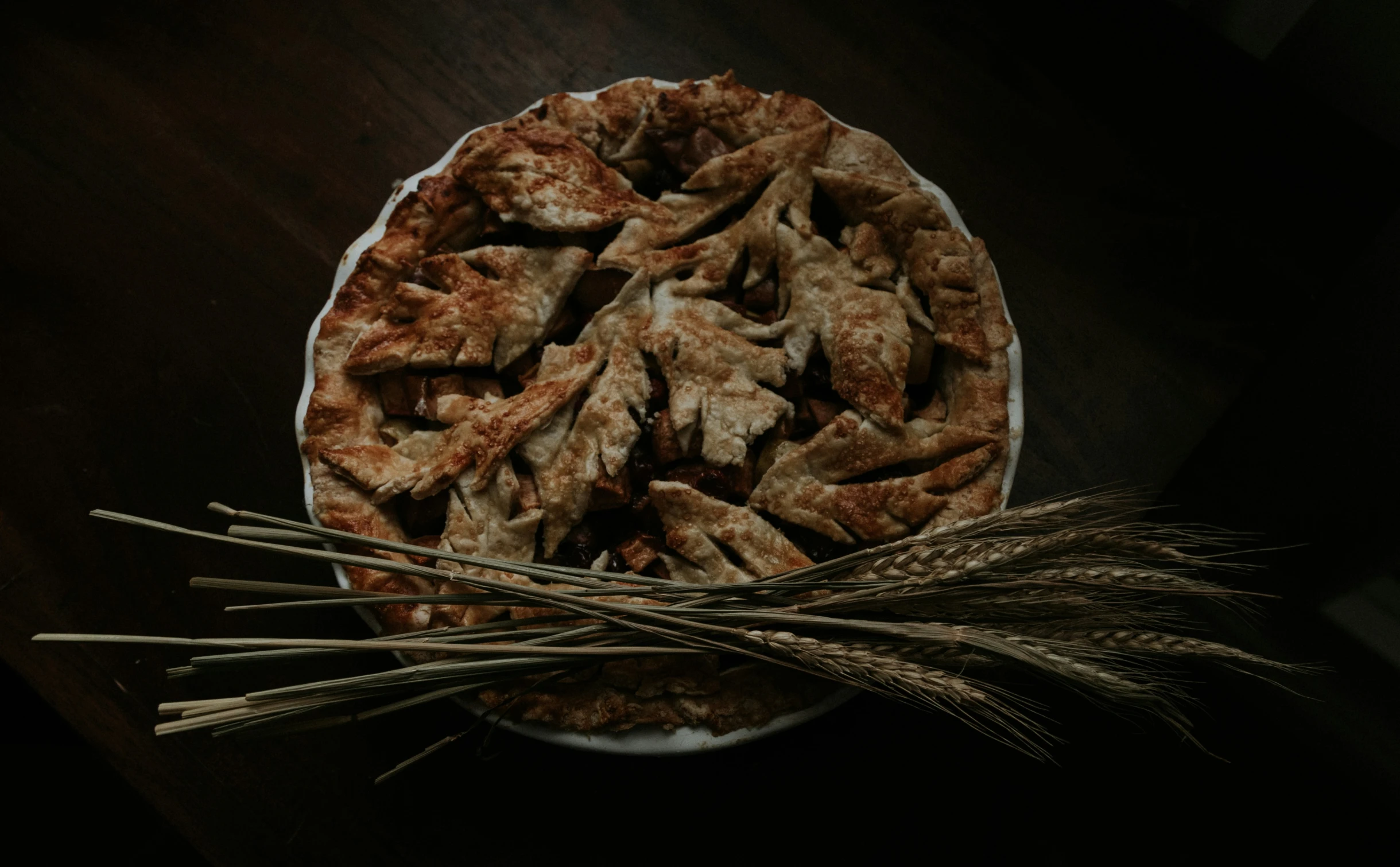 two forks sticking out of a dessert on a wooden table