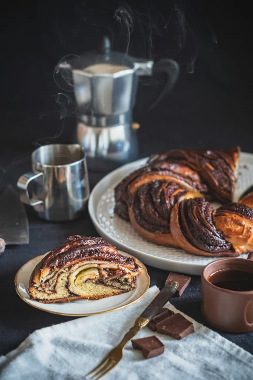 slices of cinnamon rolls and a cup of coffee