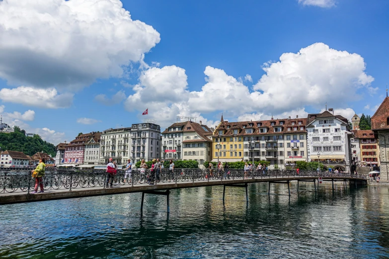 the water has clear blue waters and houses with lots of windows