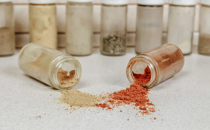 a close up of two open spice jars