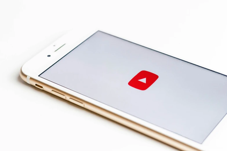 an iphone is turned on with a youtube sign