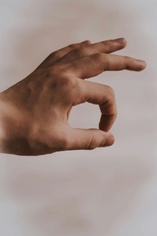 a persons hand reaching for soing