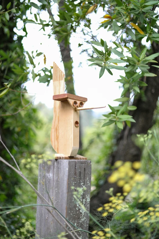 there is a bird house made of wood and wood