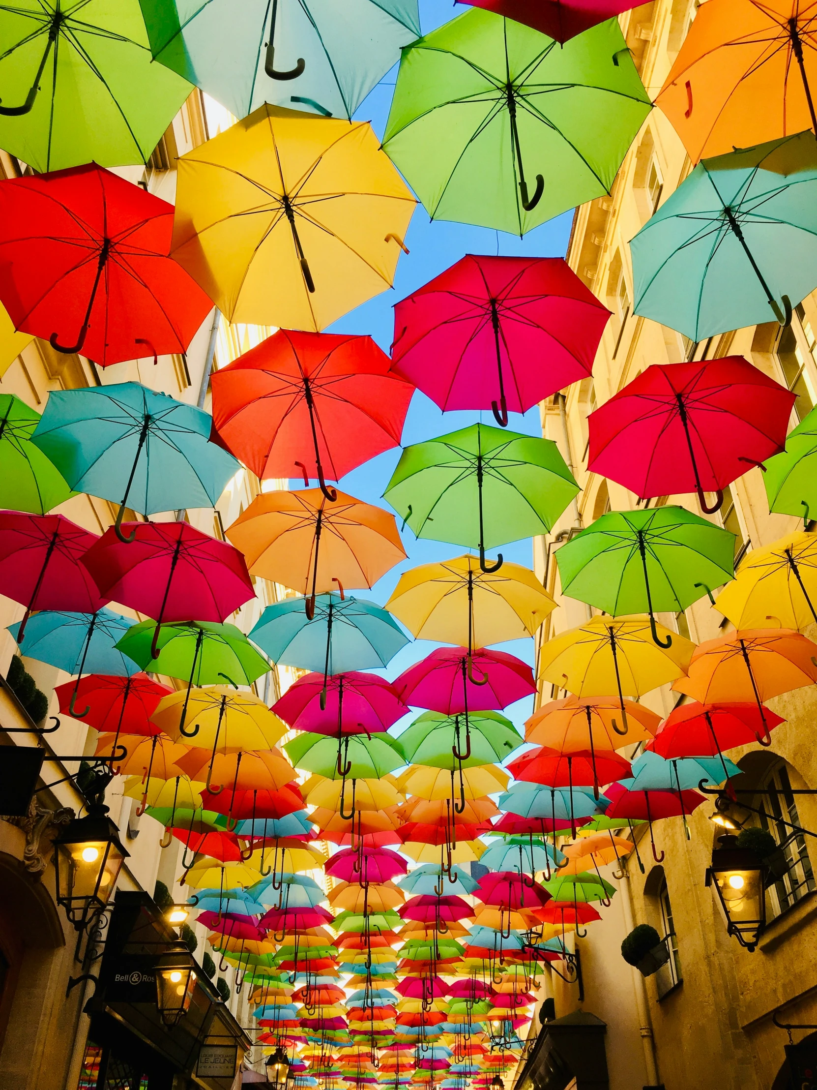 colorful umbrellas suspended in an indoor market area