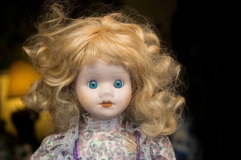 a doll with a very cute blond hair