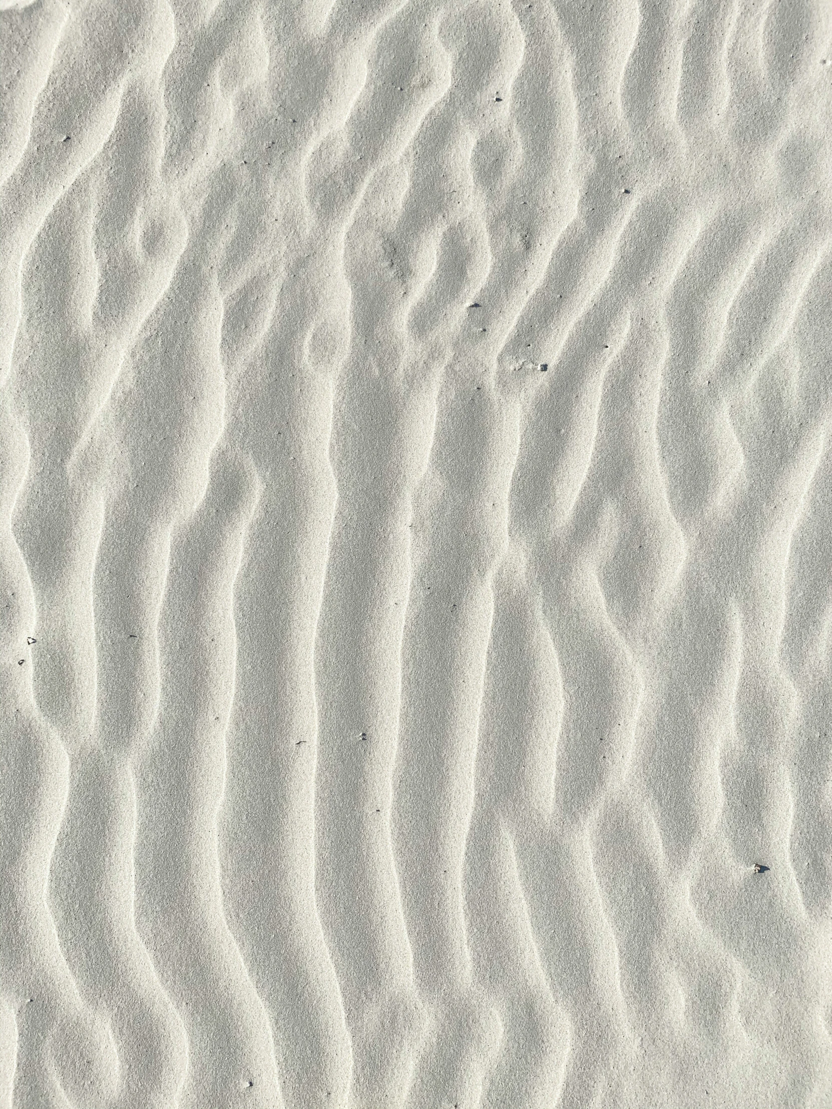 an image of patterns in the sand