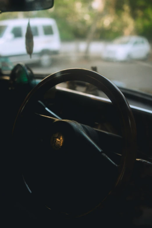 the interior of a car with dashboard showing and steering wheel visible