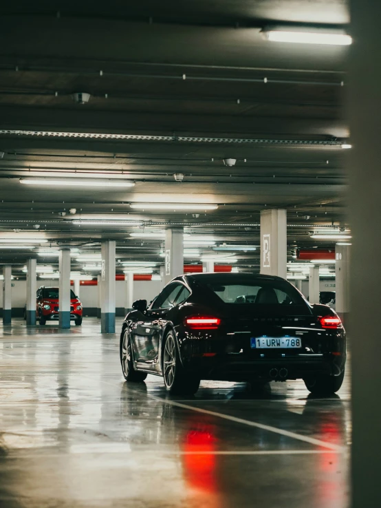 two cars parked in an empty garage