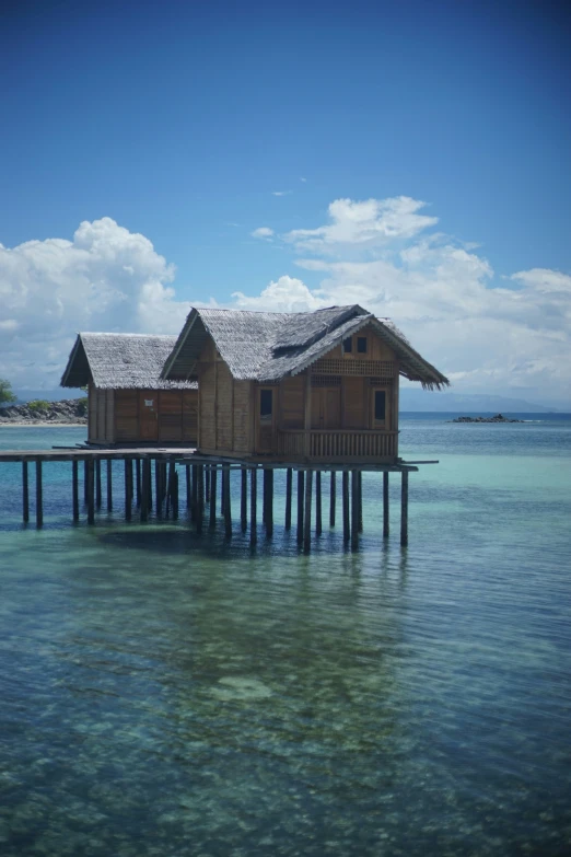 a floating building is built on top of a sea