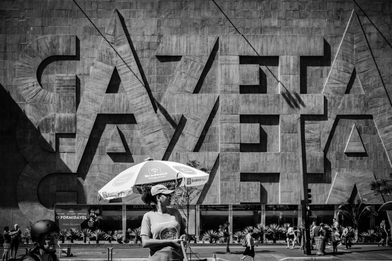 a person walking on the street holding an umbrella