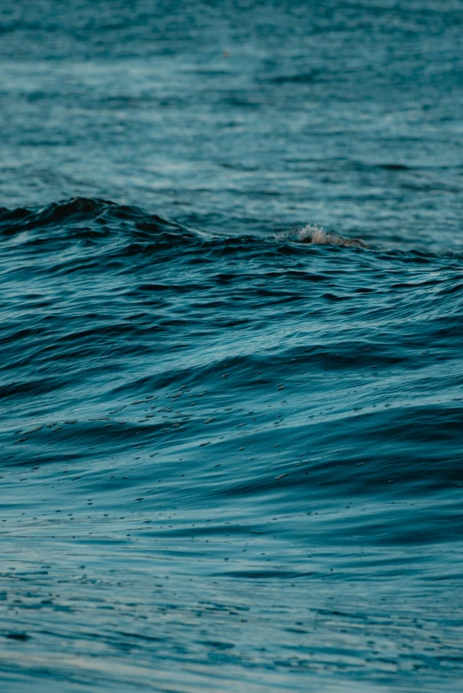 a man riding a wave with his surfboard