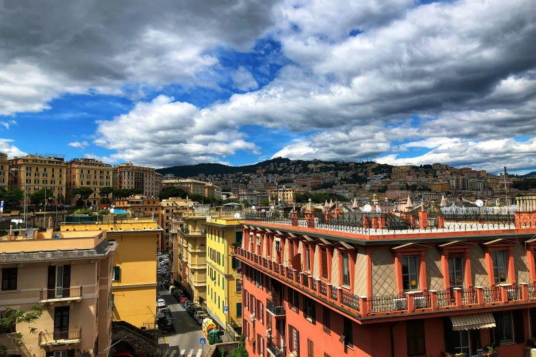 several buildings stand in the distance under a cloudy sky