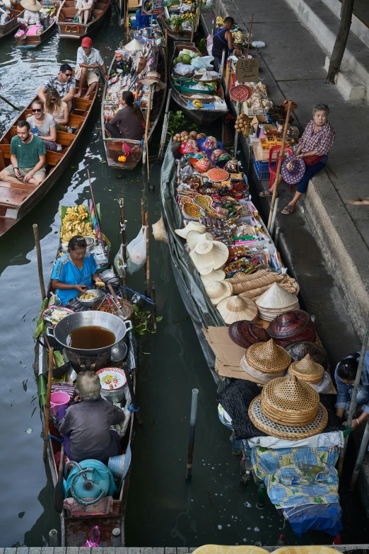 a river full of boats filled with people on them