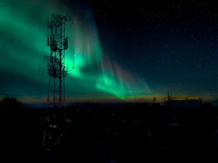 an image of a beautiful aurora lights show over the sky