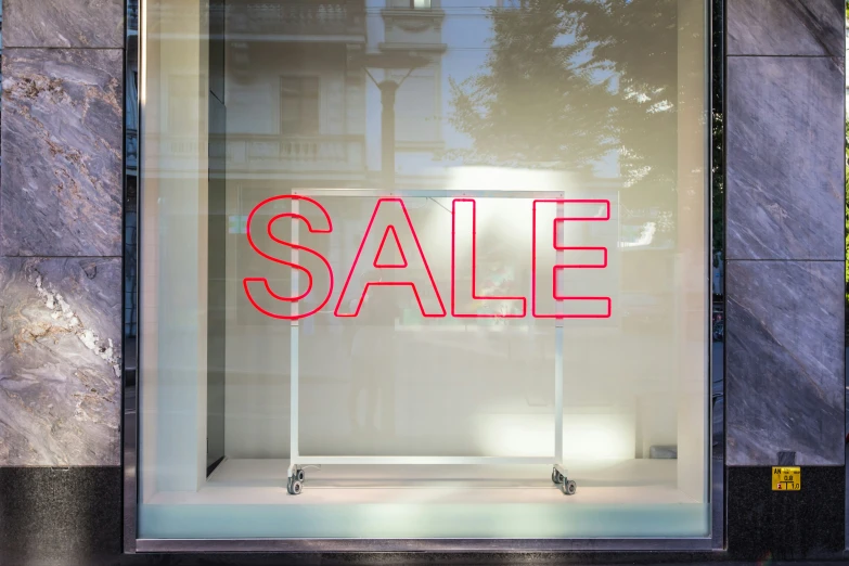 the words sale written on a glass display case