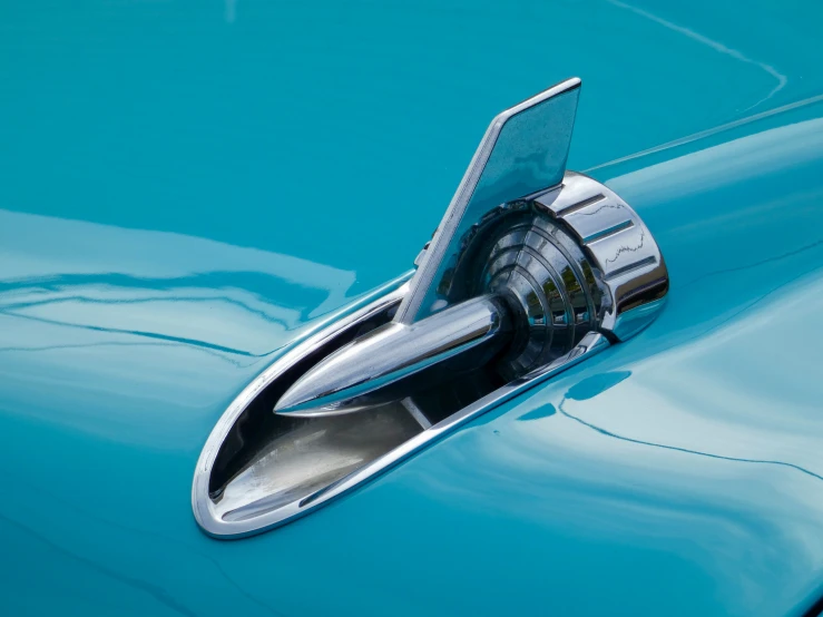 a door handle on the rear of a classic car