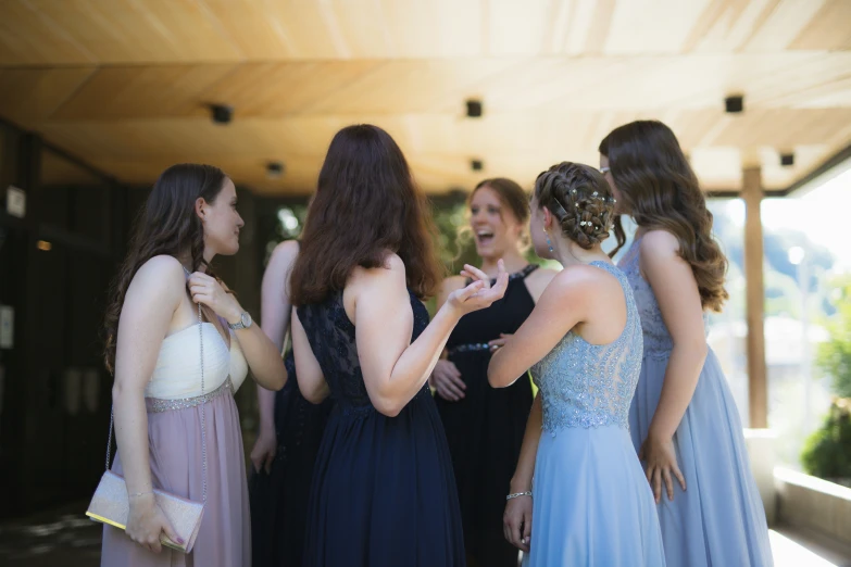 a bunch of women talking and having a party